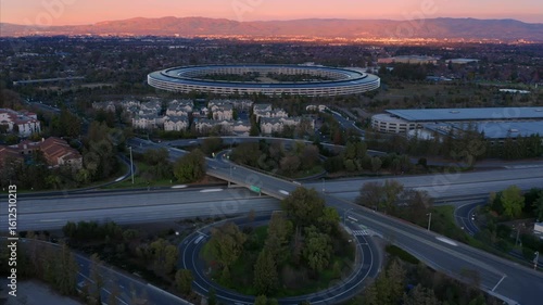 Timelapse aerial view of Apple Park headquarters. Shows the building's unique ring-shaped design.  Cupertino, California, USA.