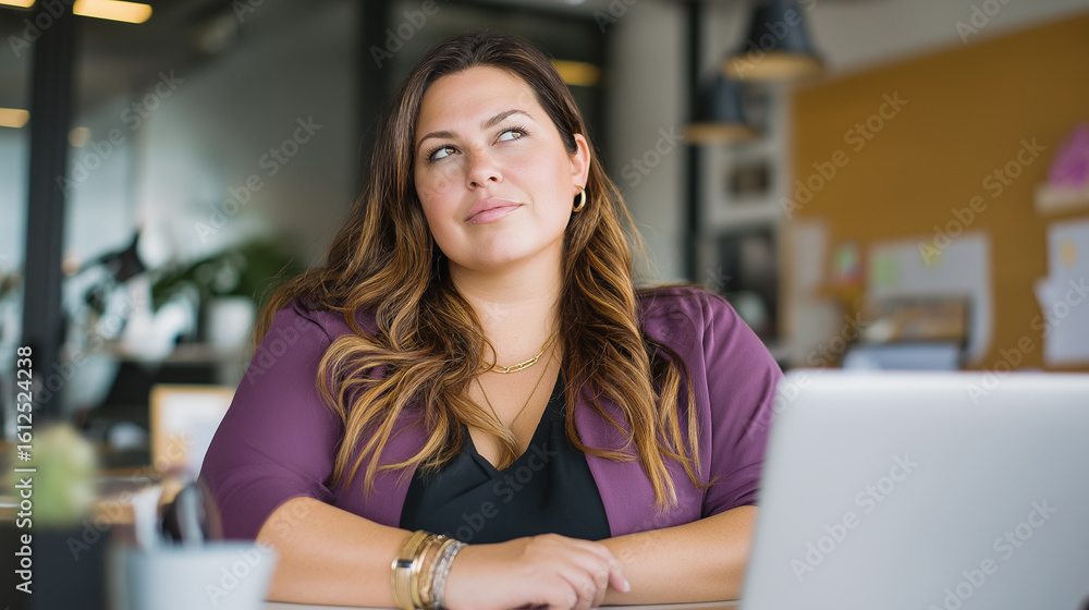 Fototapeta premium Pensive fat women sitting at desk with laptop in creative office thinking