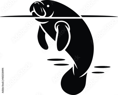 Black silhouette of a manatee swimming in water