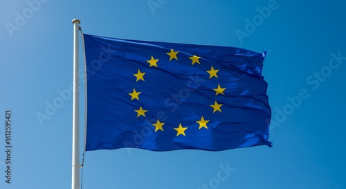 Waving European Union flag, a blue banner with yellow stars, symbolizing the united nations of Europe