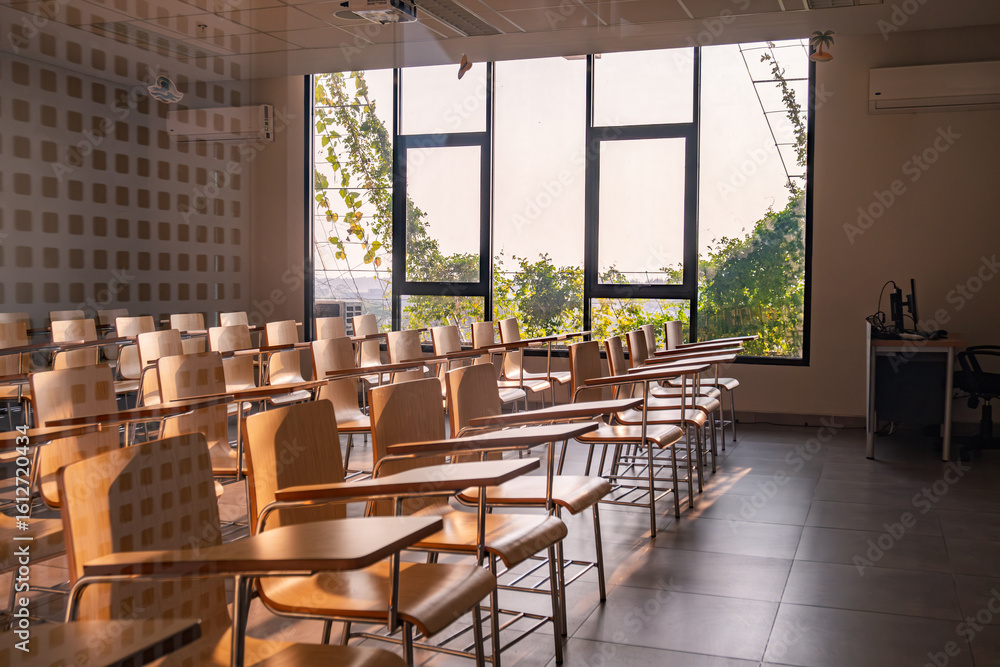 Fototapeta premium Empty Modern Classroom with Desks Chairs and Large Window Interior View