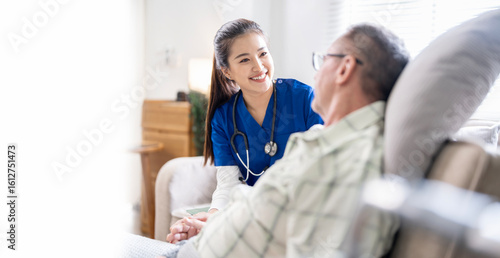 Young female doctor talking with her Elderly male patients to encourage in nursing home