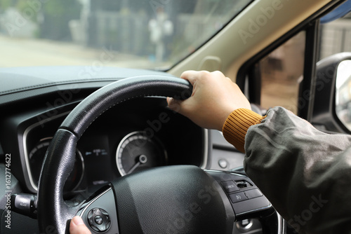 Fotografija Man is driving safely on the road