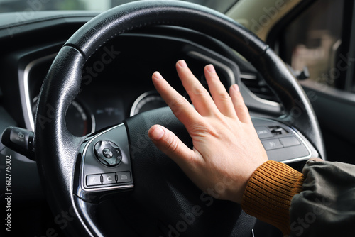 The sudden sound of a car horn startled pedestrians and they turned to look