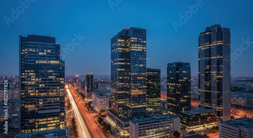 Wallpaper Mural Modern city skyline at dusk with illuminated skyscrapers and busy street below Torontodigital.ca