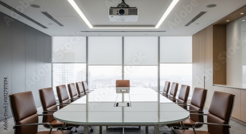 Modern conference room with long oval table and comfortable chairs facing large windows