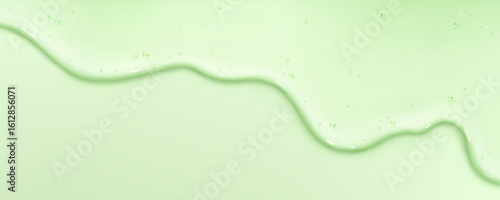 Green gel liquid drip flowing on pastel background - transparent cosmetic serum texture with smooth wavy stream, glossy skincare essence drop down. Beauty product fluid for spa wellness presentation.