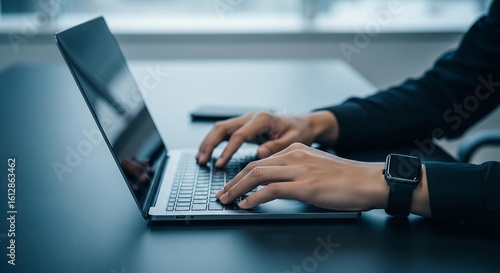 Close-up of hands typing on laptop keyboard. Modern workspace with no face visible. Suitable for business, freelance, tech, or remote work concepts.