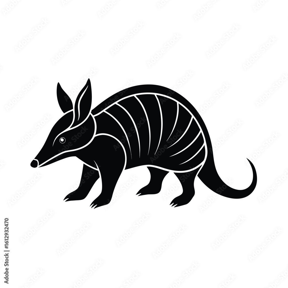 Obraz premium A solitary armadillo walks slowly in a stark black silhouette against a clean white background