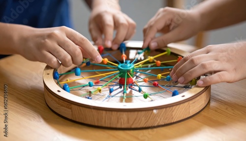Childrens Hands Engaging with Colorful Wooden Educational Toy on Tabletop.