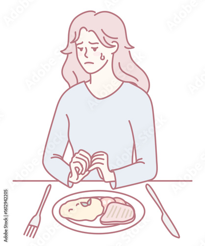 A woman appears to be visibly distressed as she sits alone at a table, staring at her untouched meal in sadness