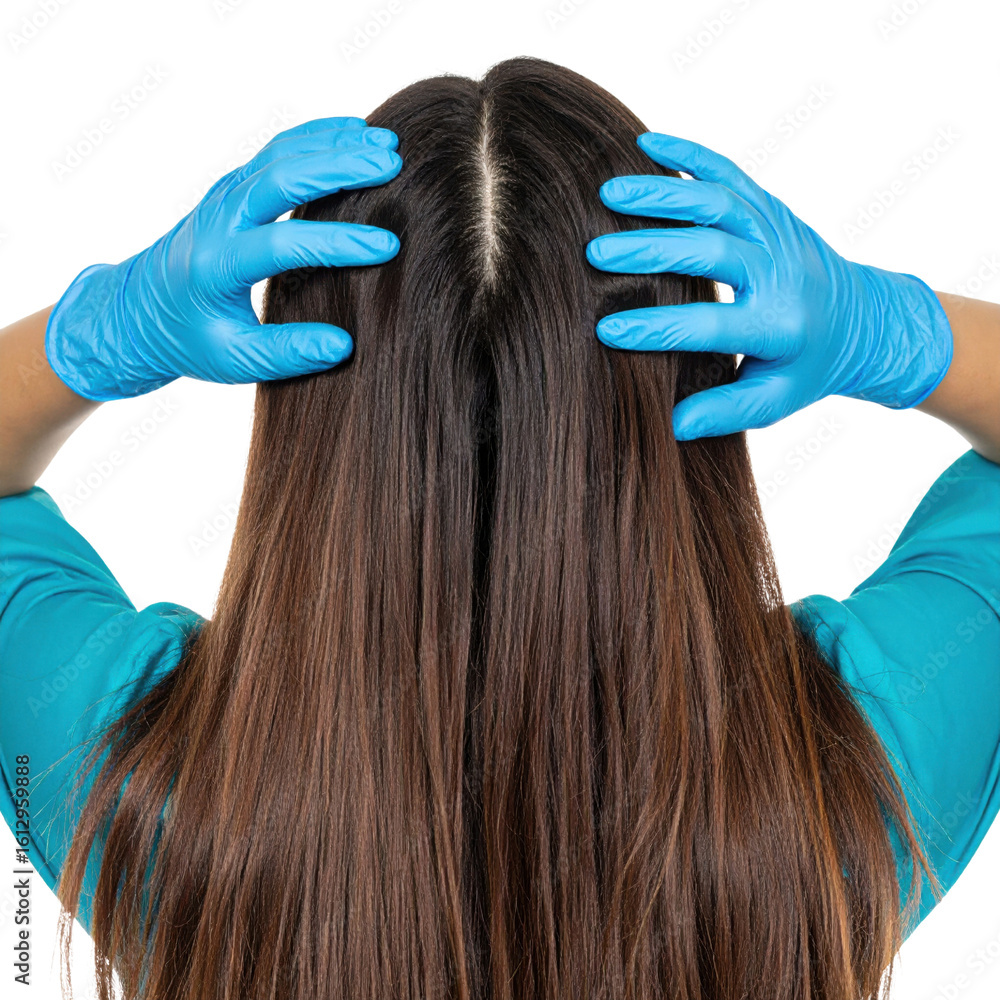 Naklejka premium A person with long brown hair wearing blue gloves is placing their hands on their head, showing a clear middle hair part.