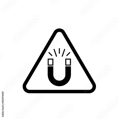Black and white warning sign depicting a magnet with radiating lines inside a triangle, indicating a magnetic field hazard.