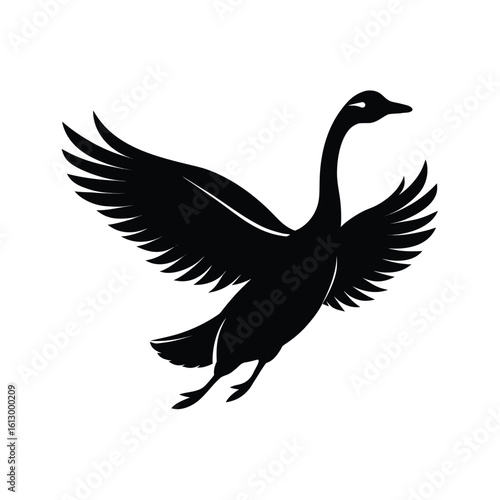 Elegant black silhouette of a goose with its long neck gracefully stretched in flight
