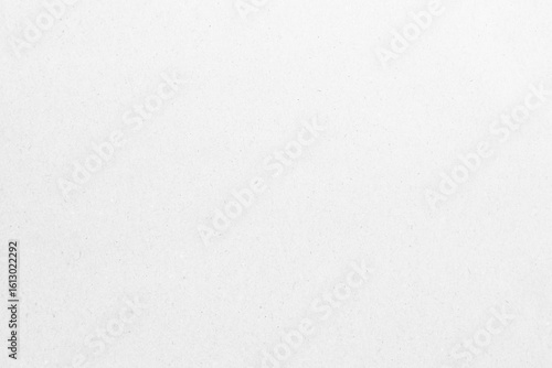 White recycled craft paper texture as background. Grey paper texture, Old vintage page or grunge vignette of old newspaper. Pattern rough art creased grunge letter. Hardboard with copy space for text.