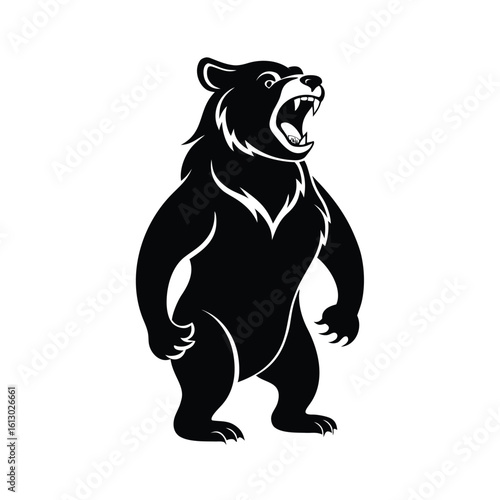 Powerful black silhouette of a bear standing on hind legs roaring fiercely
