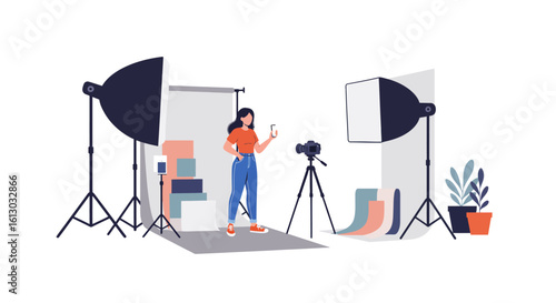 Woman in Photography Studio with Camera and Lighting Equipment Holding Phone.