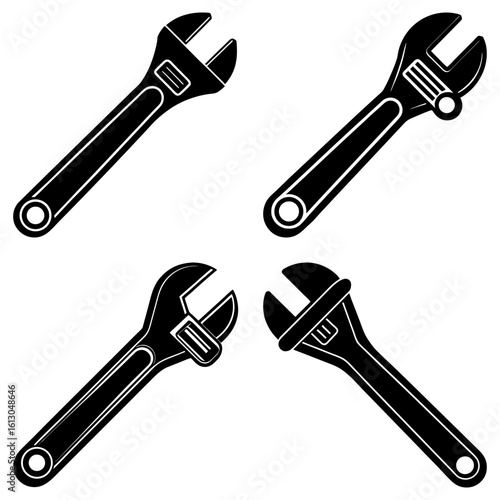 Four adjustable wrenches in black and white display a variety of angles and orientations on a white background