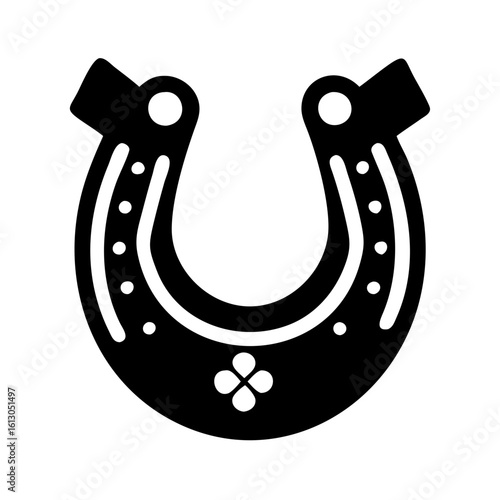 Horseshoe silhouette icon symbol of luck-Black and white silhouette of a horseshoe with decorative details, commonly used as a good luck charm or western-themed icon.