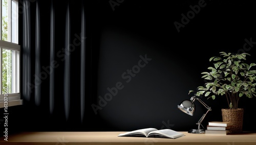 A softly lit workspace features an open book, desk lamp, and potted plant on a wooden surface against a dark wall, illuminated by filtered sunlight