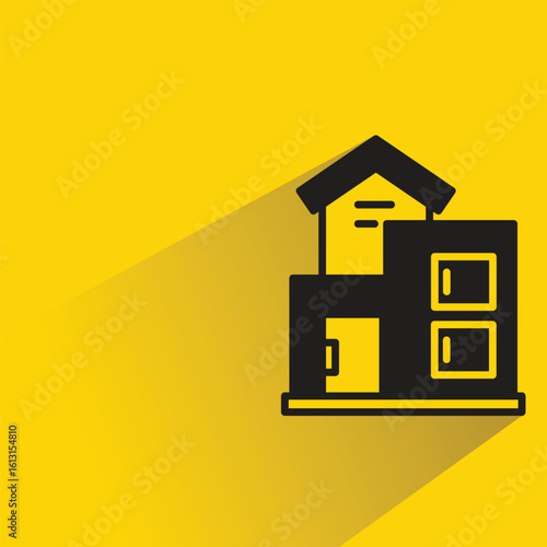 house building icon with shadow on yellow background