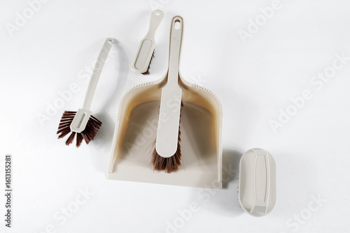 Scoop and brush cleaning kit isolated on white background
