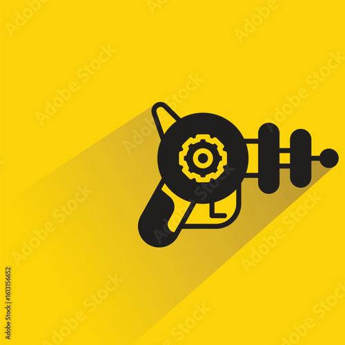 space gun with shadow on yellow background