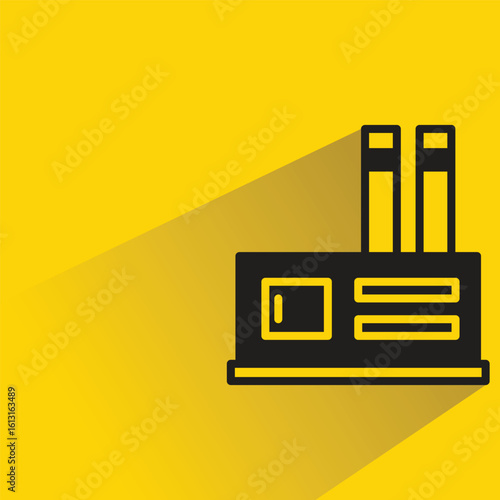 factory building icon with shadow on yellow background