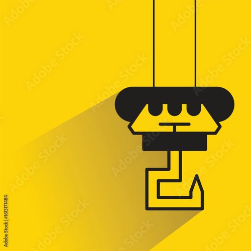 hoist and hook icon with drop shadow on yellow background