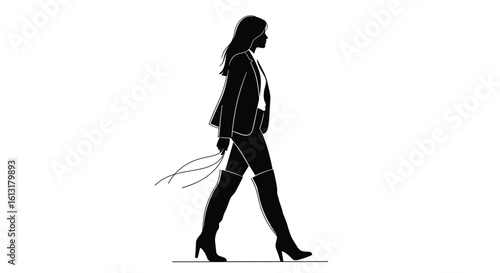 Elegant Woman in Fashionable Attire Strides Confidently on a Catwalk Displaying Professional Style