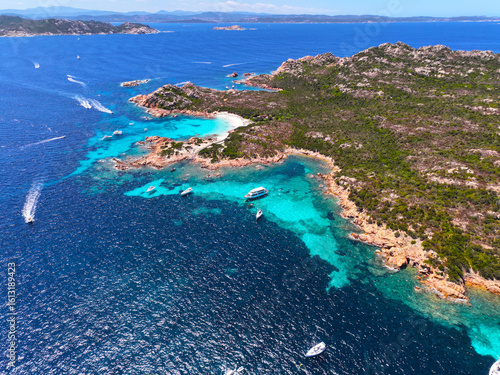 Fototapeta Naklejka Na Ścianę i Meble -  Isola Budelli. Arcipelago della Maddalena. Island Budelli. Sardinia, Italy. Beaches of Sardinia. Boats and yachts. Incredible colors and views. View from above. Drone view of Sardinia. Sea. Ocean.