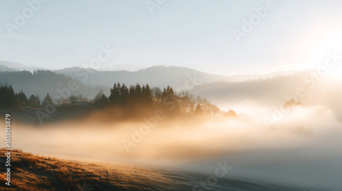 Wallpaper Mural Serene landscape featuring misty mountains and a soft sunrise, creating a peaceful atmosphere in nature. Torontodigital.ca