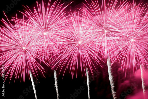 Strontium ignites vibrant pink fireworks in night sky