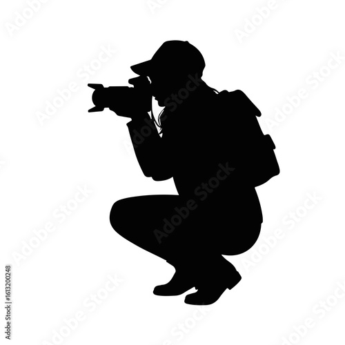 Female photographer squatting in profile, black silhouette on white background
