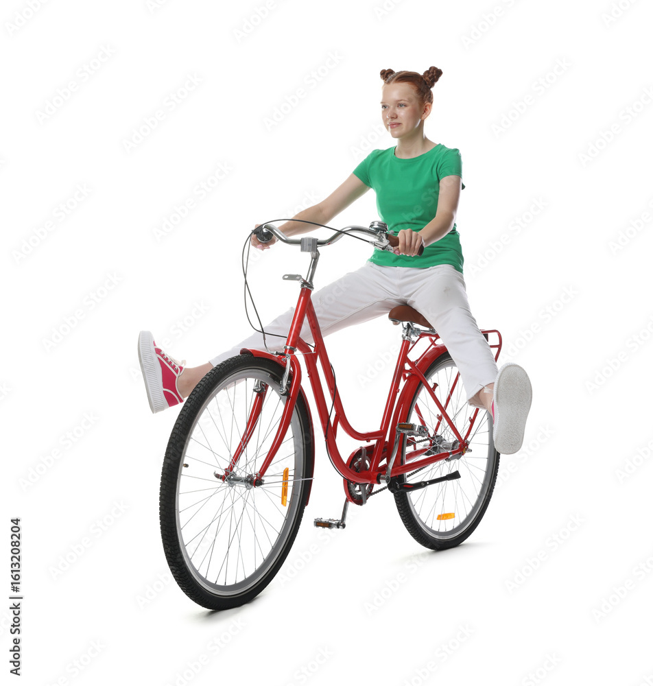 Naklejka premium Teenage girl riding bicycle on white background
