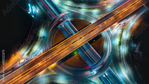 Expressway top view, Road traffic an important infrastructure, car traffic transportation above intersection road in city night, aerial view cityscape of advanced innovation, financial technology	