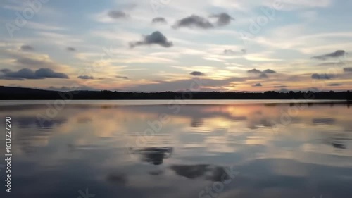 Wallpaper Mural Calm lake reflecting a colorful sunset sky Torontodigital.ca