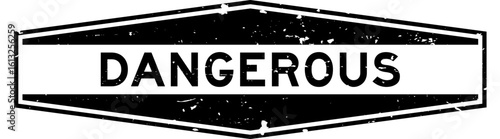 Grunge black dangerous word hexagon rubber seal stamp on white background