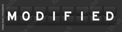 Black color analog flip board with word modified on gray background