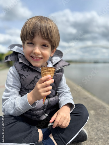 Boy enjoying a delicious ice cream on a sunny day