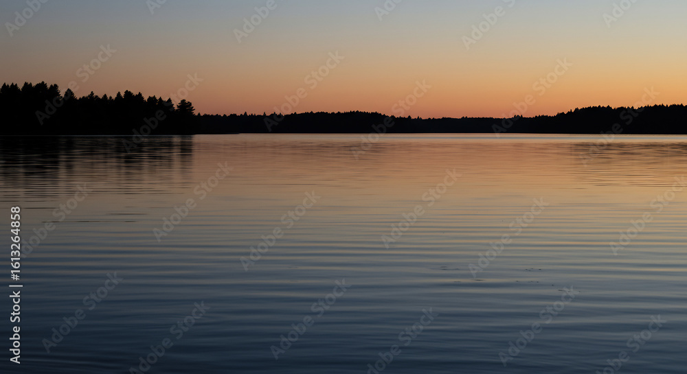 gentle ripples on a still lake at dusk, reflecting the soft hues of the twilight sky and distant silhouetted trees gentle ripples on a still lake at dusk, reflecting the soft hues of the twilight sky and distant silhouetted trees