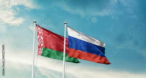 Belarus and Russia friendship flags are waving in the sky. Double country Flag waving with mast. Belarus Russia national flag for agreement.