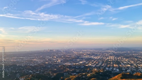 Wallpaper Mural Panoramic Aerial View of Los Angeles Cityscape with Orange and Blue Sky at Sunset Over The Hillside Torontodigital.ca