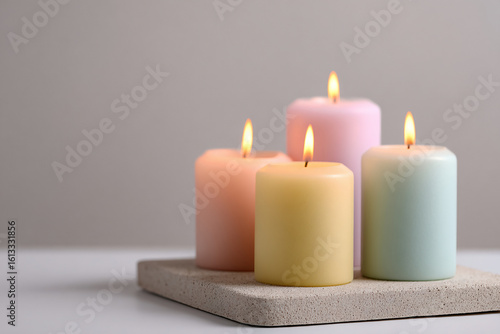 Wallpaper Mural Set of minimalist pastel candles lit on a neutral stone tray, soft warm light and clean background Torontodigital.ca