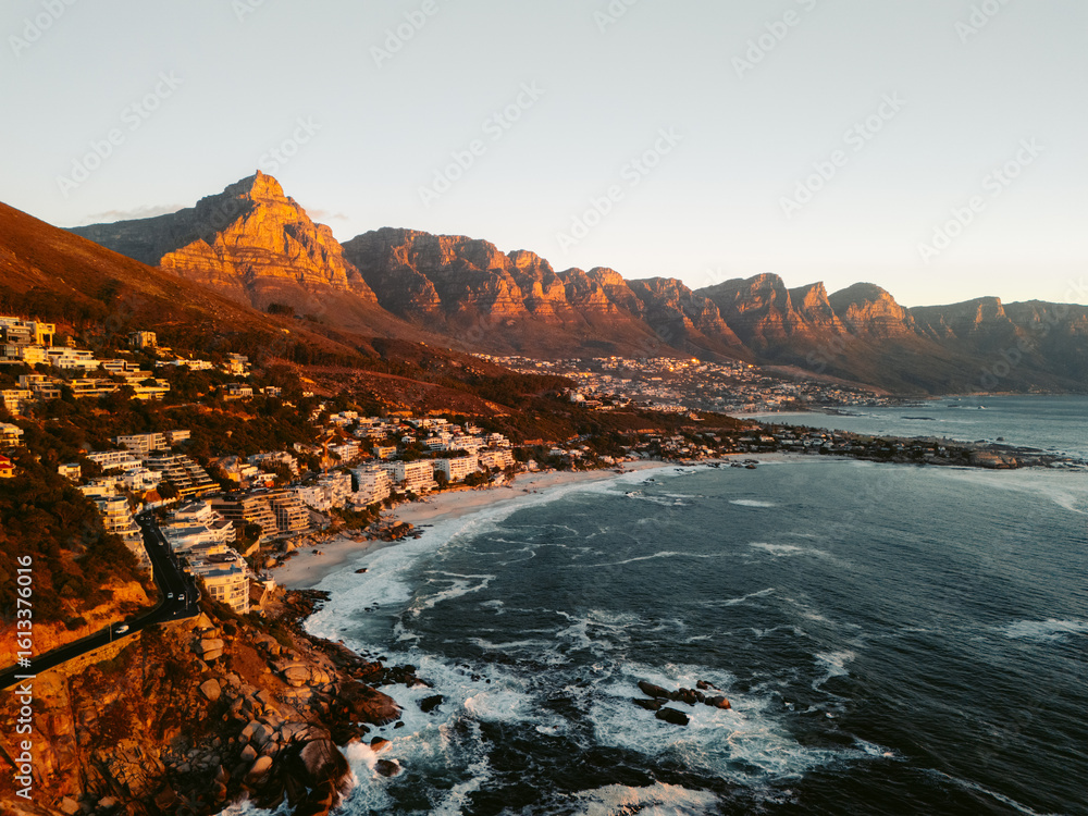 Fototapeta premium Aerial View of Camps Bay, Cape Town at Sunset with Mountain Backdrop