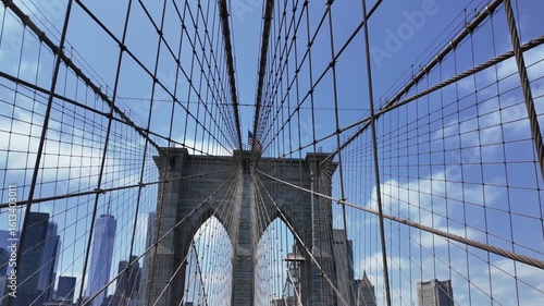 As I gaze up at the magnificent Brooklyn Bridge that spans across the East River in New York City, I am struck by its beauty and engineering