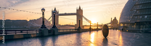 Photography Golden morning light casts a warm glow over Tower Bridge from Queen's Walk