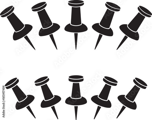 Black thumbtacks arranged in two rows