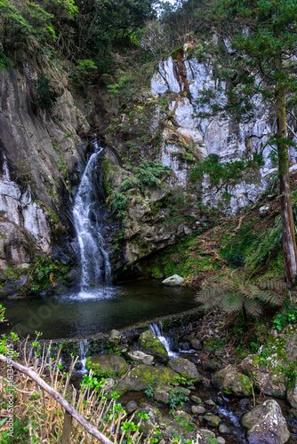 Limbo Waterfall in São Miguel Island, Azores, surrounded by lush greenery and volcanic rock, showcasing the natural beauty of the Azores archipelago.