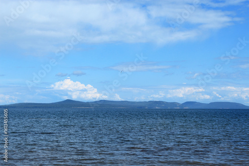 Bratsk Reservoir with Clear Sky and Distant Forested Shores